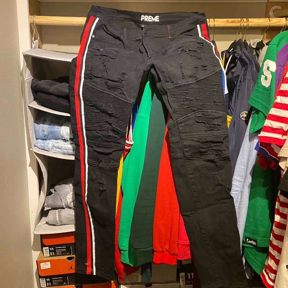 Men black jeans with red and white stripes on side
